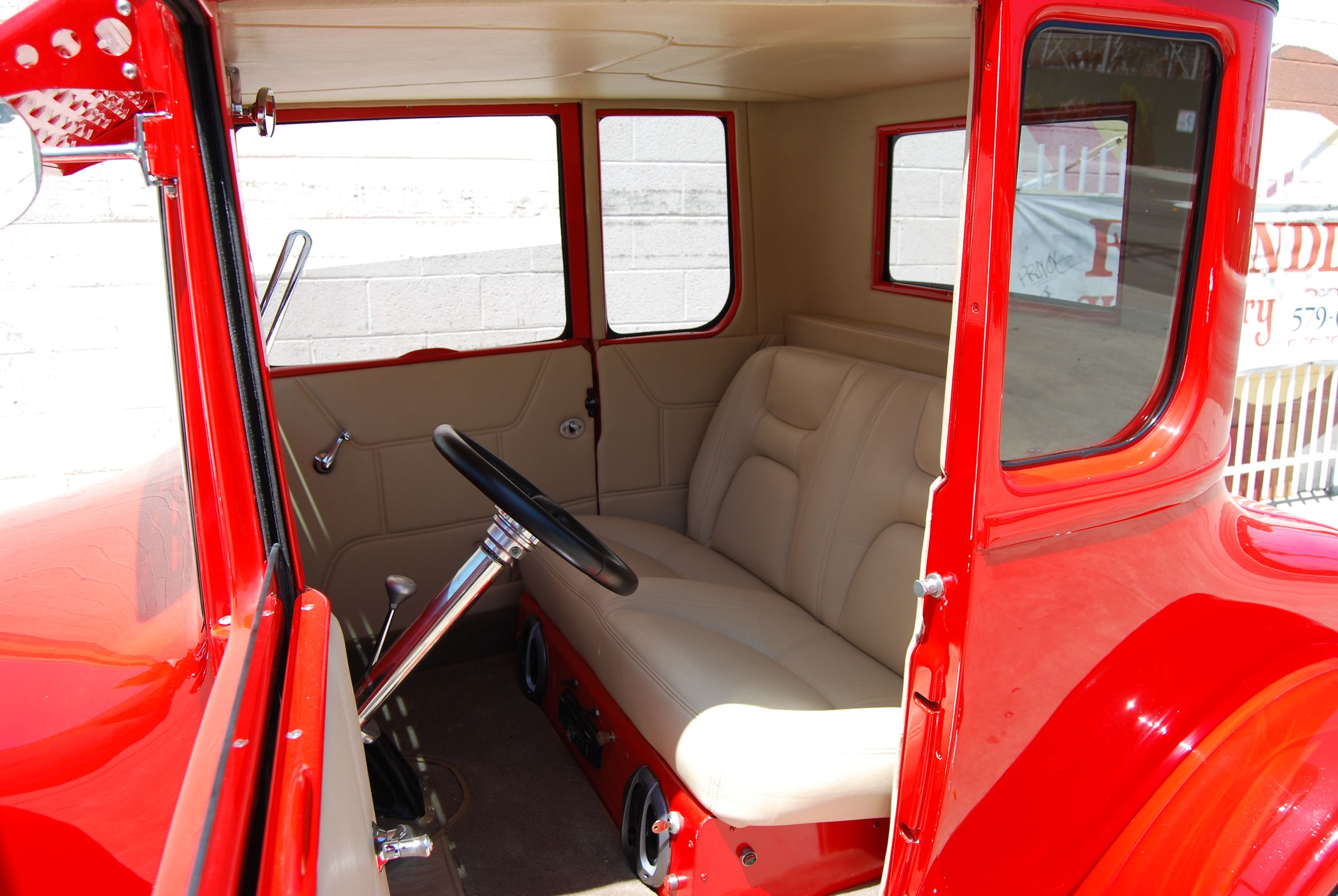 Vintage Ford interior with cream tuck-and-roll bench seat